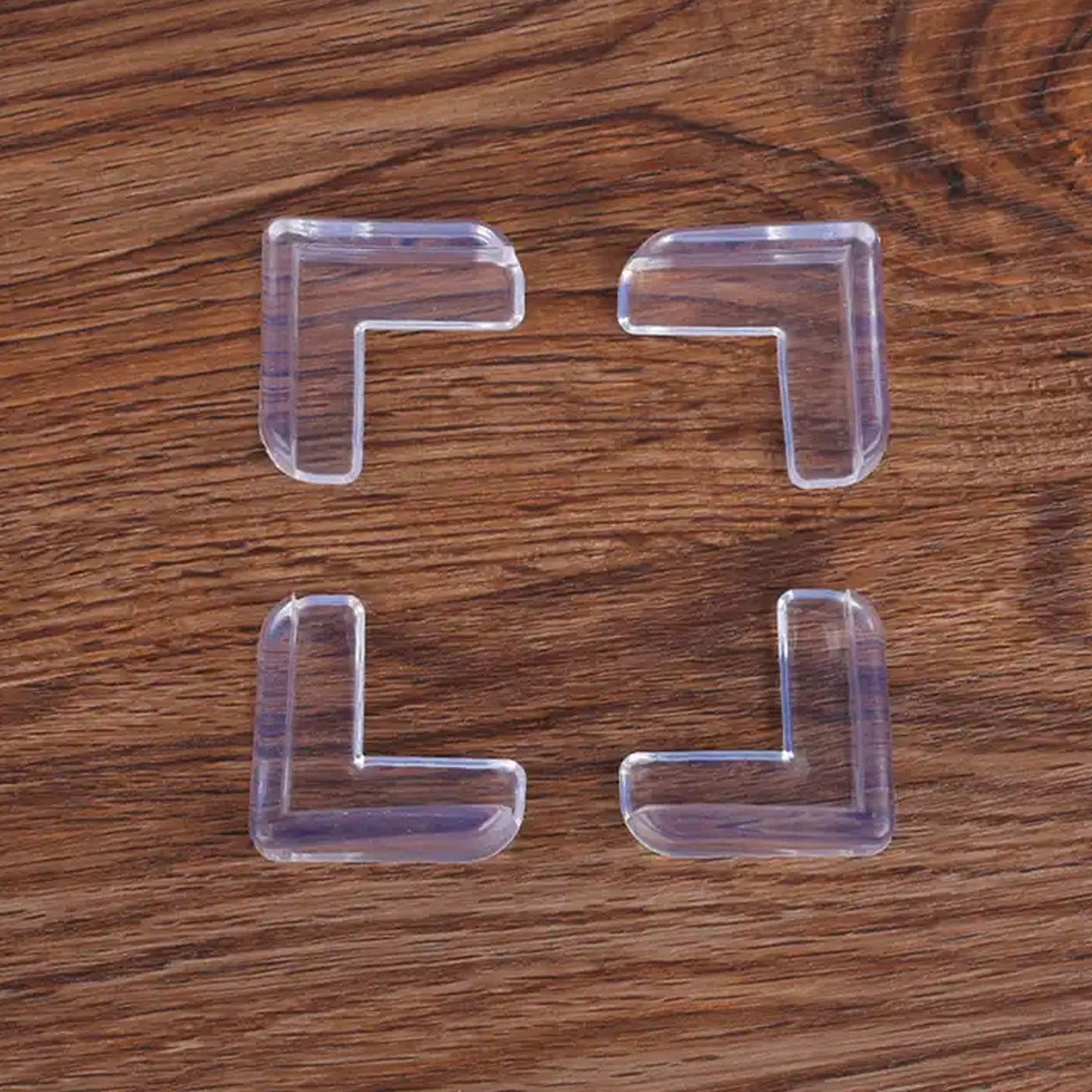 Flexible clear silicone corner guard on a furniture edge, showcasing its protective design.