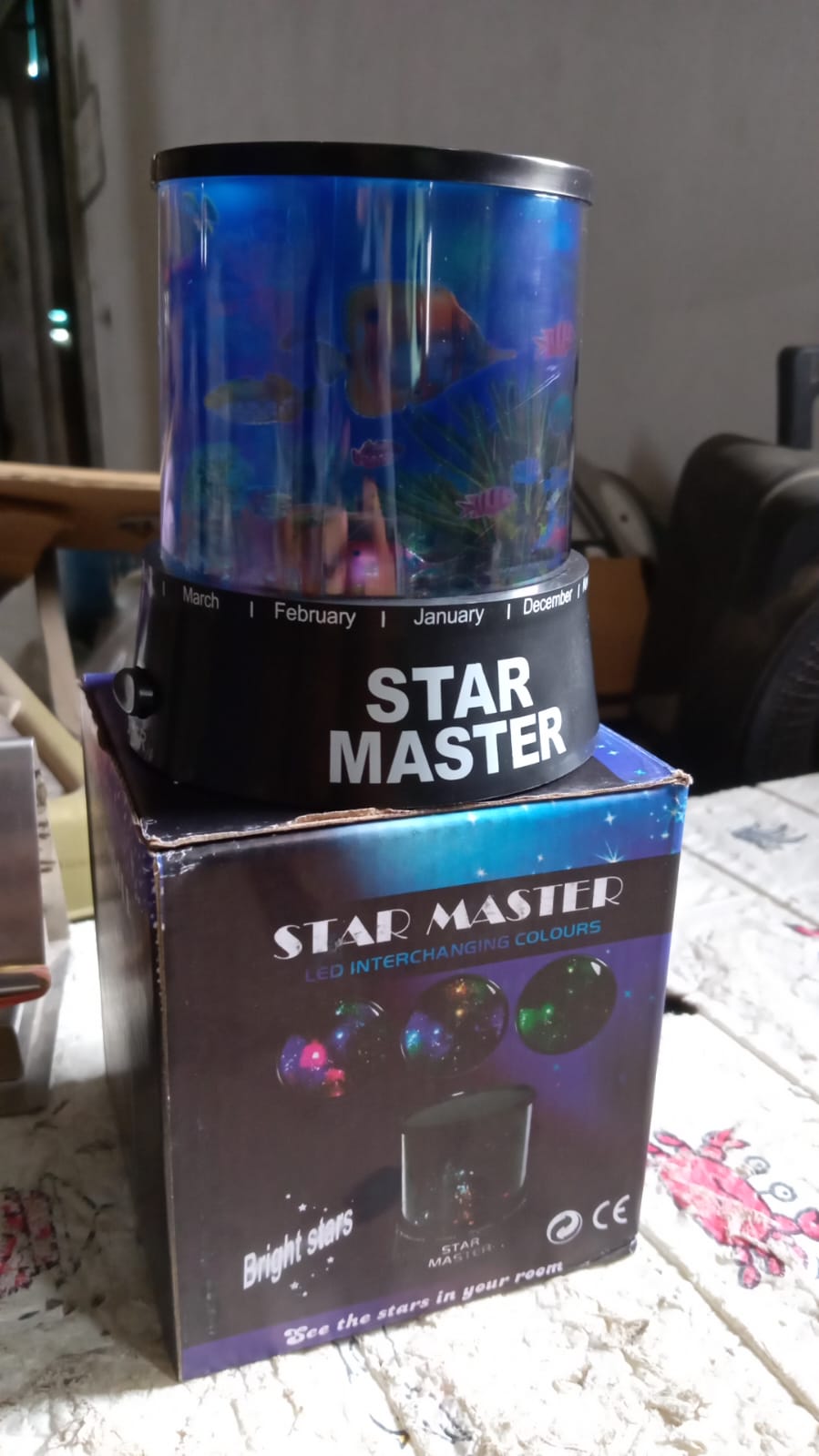 A romantic bedroom setting enhanced by the soft, swirling projections of the home decor night light.