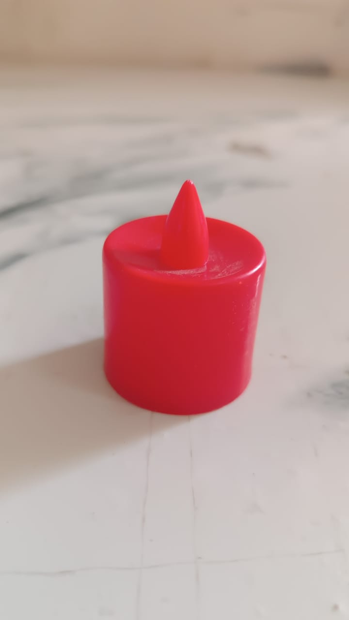 Red LED tea light diya, showcasing its simple ON/OFF switch at the base.