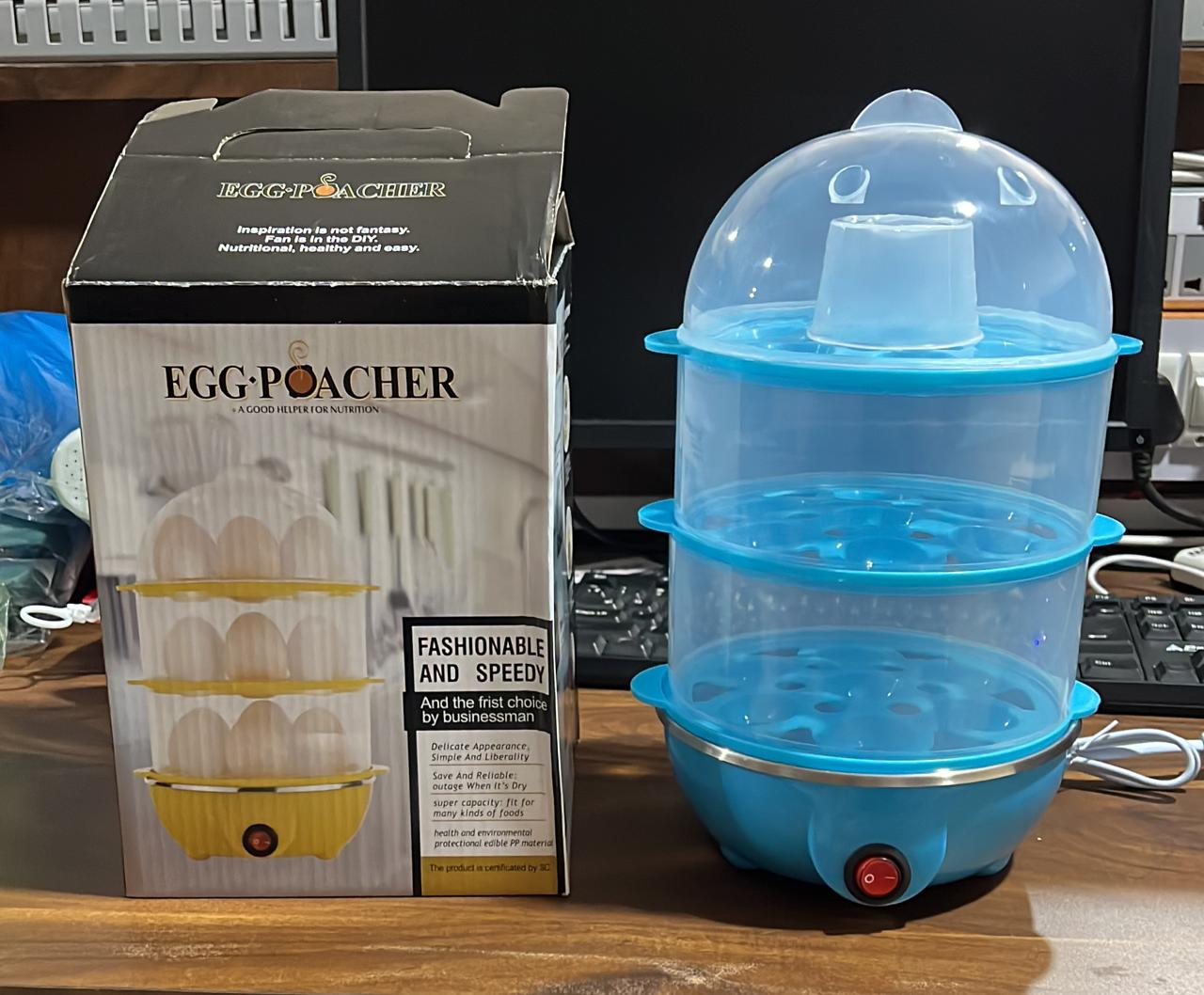 Compact electric egg cooker with all accessories for easy breakfast preparation.