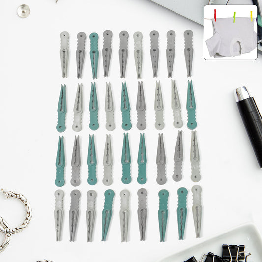A set of 36 colourful plastic cloth pegs in a clear plastic basket, ready for laundry.