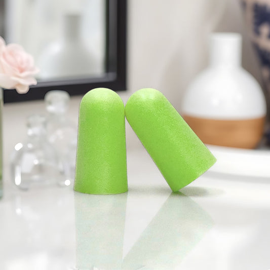 Soft foam noise reduction earplugs with storage case, ready for travel.