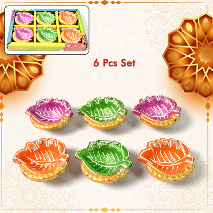 Set of six vibrant hand-painted clay diyas with mixed traditional designs, perfect for Diwali celebrations.