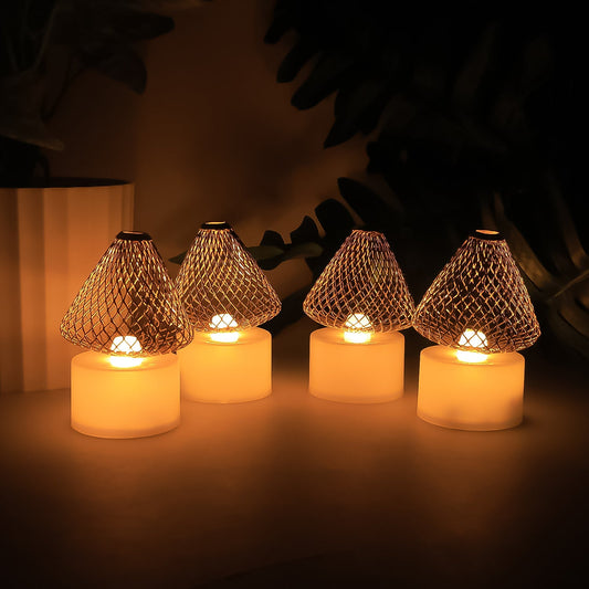 Set of 4 LED flameless candle lights with decorative mesh lampshades providing warm white glow