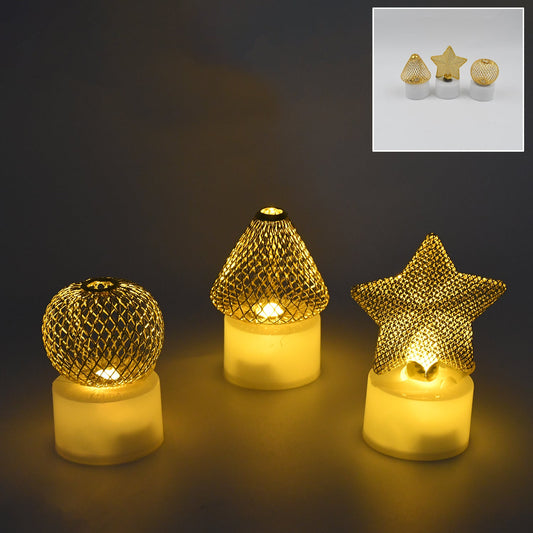 Set of three white flameless LED candles glowing warmly in a decorative arrangement.