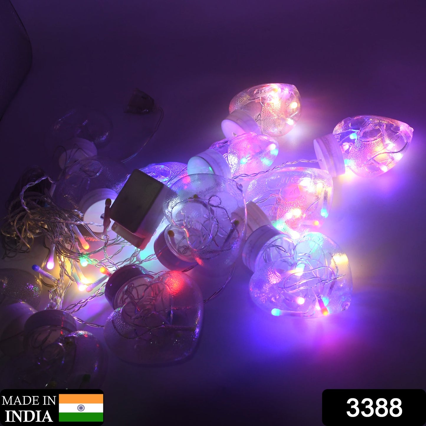 Close-up of vibrant heart-shaped LED wish balls on a decorative string light for Diwali.
