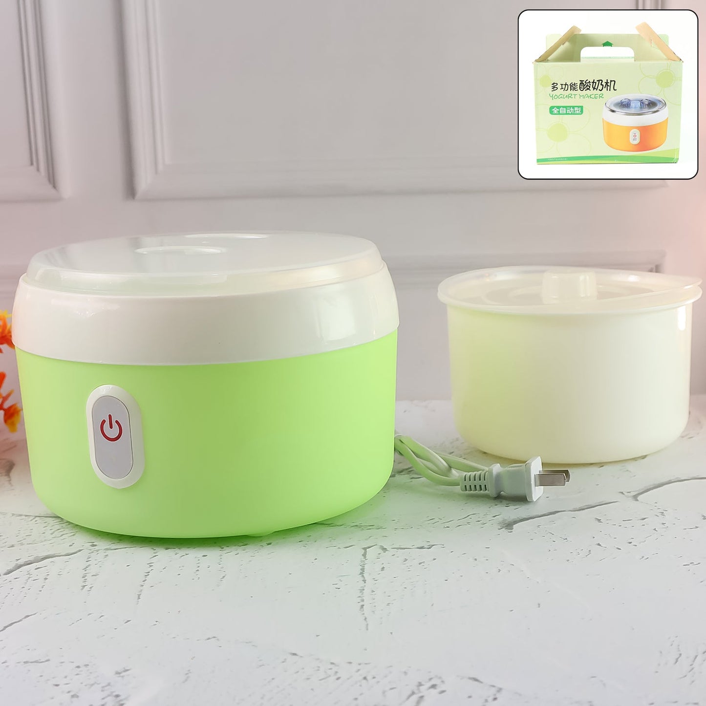 Green electric yogurt maker on a kitchen counter, ready to make homemade curd.