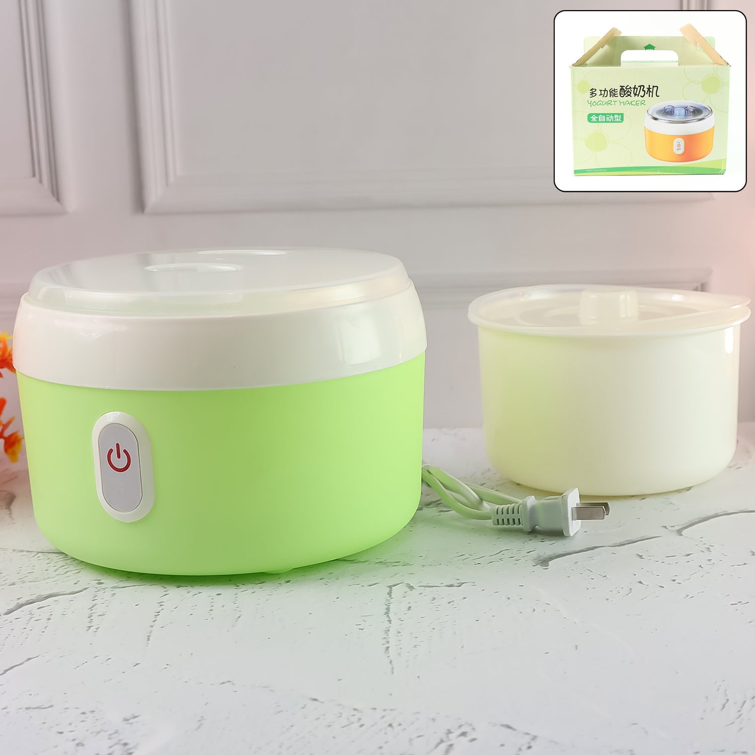 Green electric yogurt maker on a kitchen counter, ready to make homemade curd.