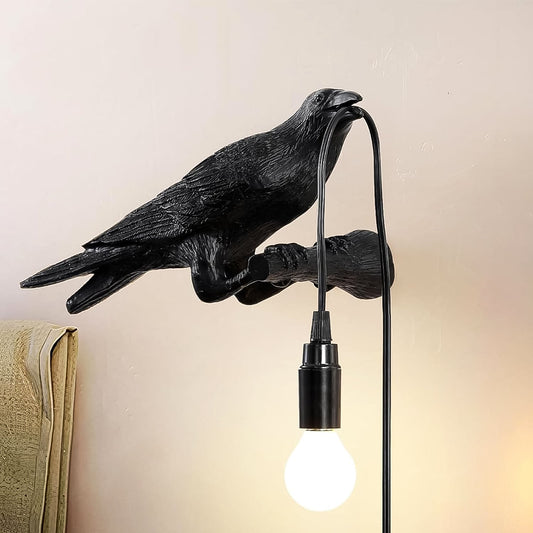 A stylish crow table lamp featuring a vintage Edison bulb, perfect for ambient lighting.