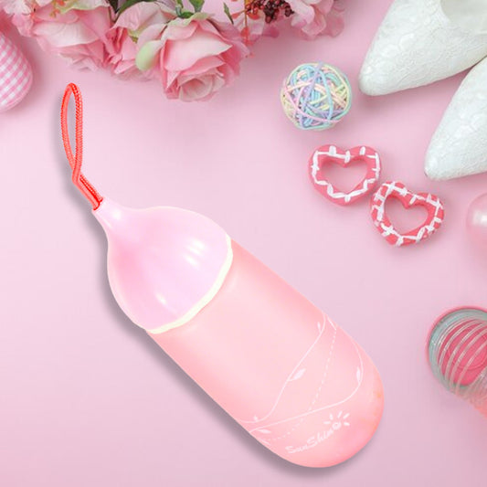 Front view of the unique shape plastic water bottle with a convenient carrying dori.