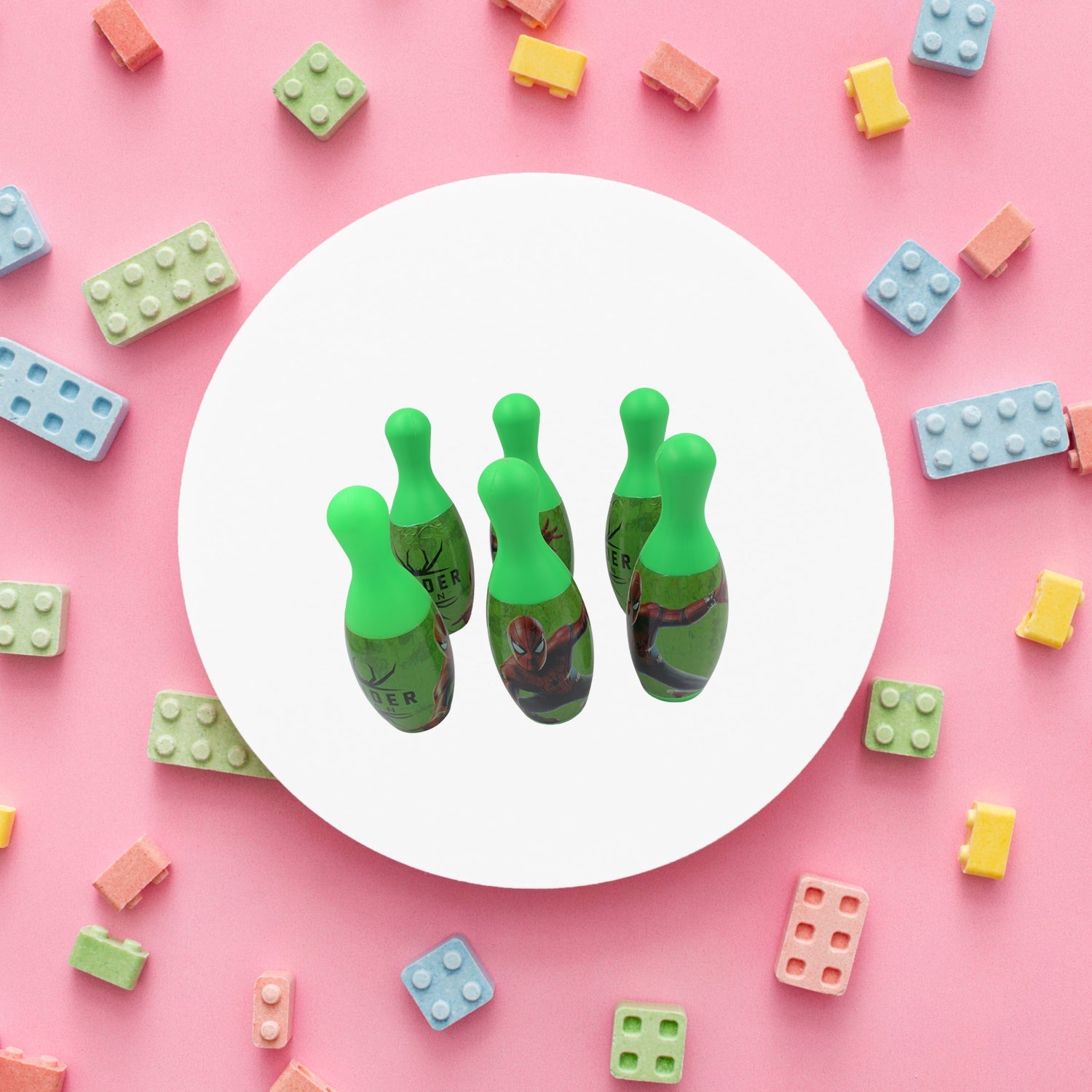 Arrangement of vibrant bowling pins and a ball, ready for a fun kids' game.