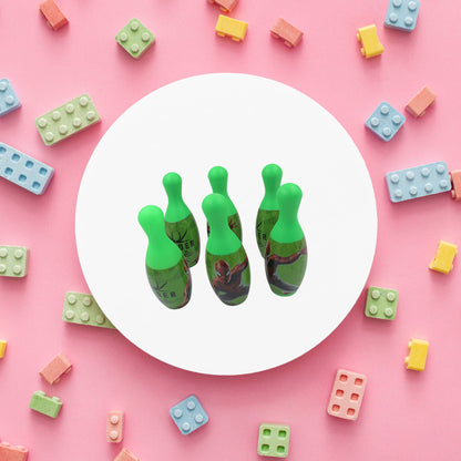 Arrangement of vibrant bowling pins and a ball, ready for a fun kids' game.