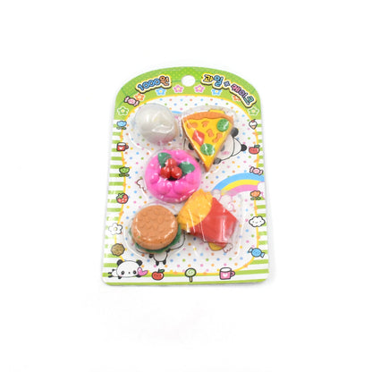 Several cute erasers in different food shapes scattered playfully across a surface.