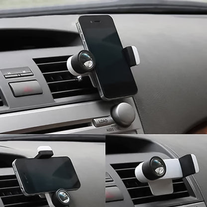 Universal car phone mount with gravity design gripping a smartphone