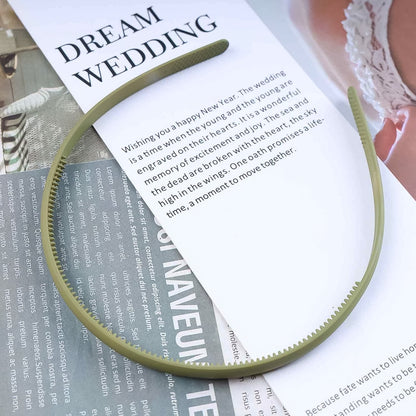 Flexible comb style plastic headband for secure hair grip