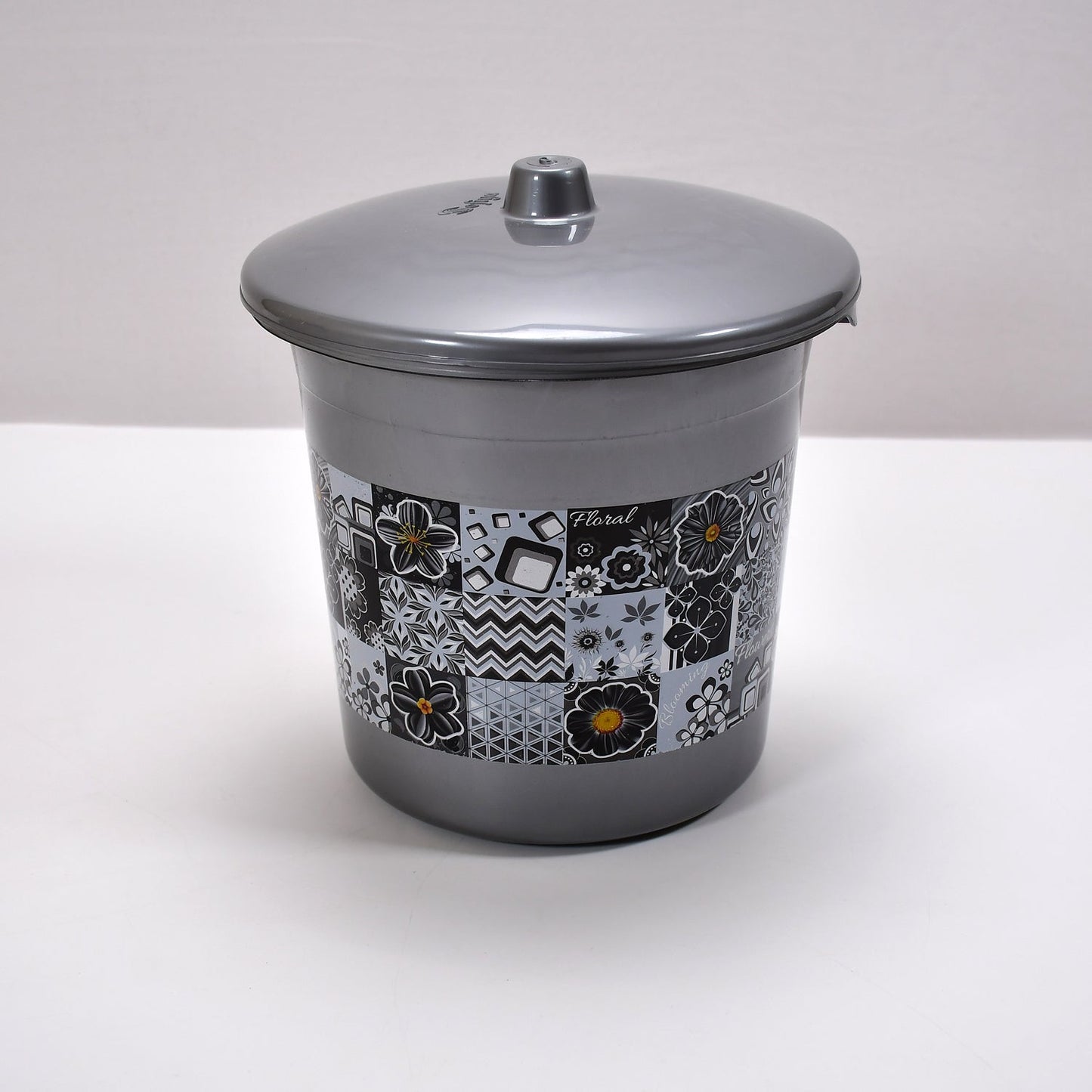 Detailed shot of the plastic bathroom accessories, emphasizing the quality and finish of the set.