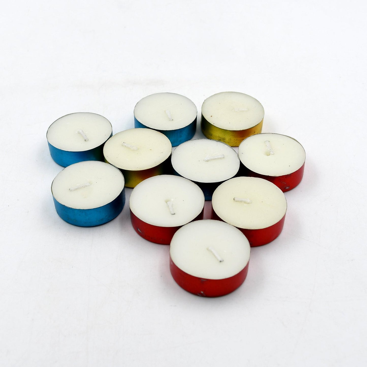 Close-up of assorted decorative candles showcasing their rich colors.