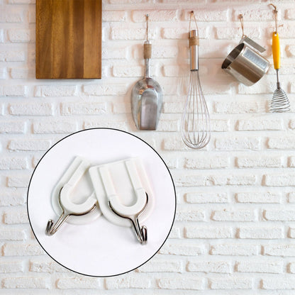 Close-up of a sturdy adhesive wall hook applied to a smooth ceramic tile surface.