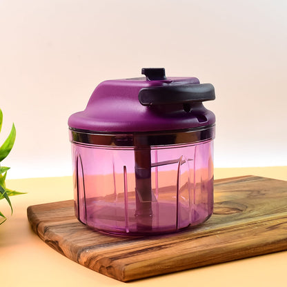 Compact manual vegetable chopper showing hand-pull operation
