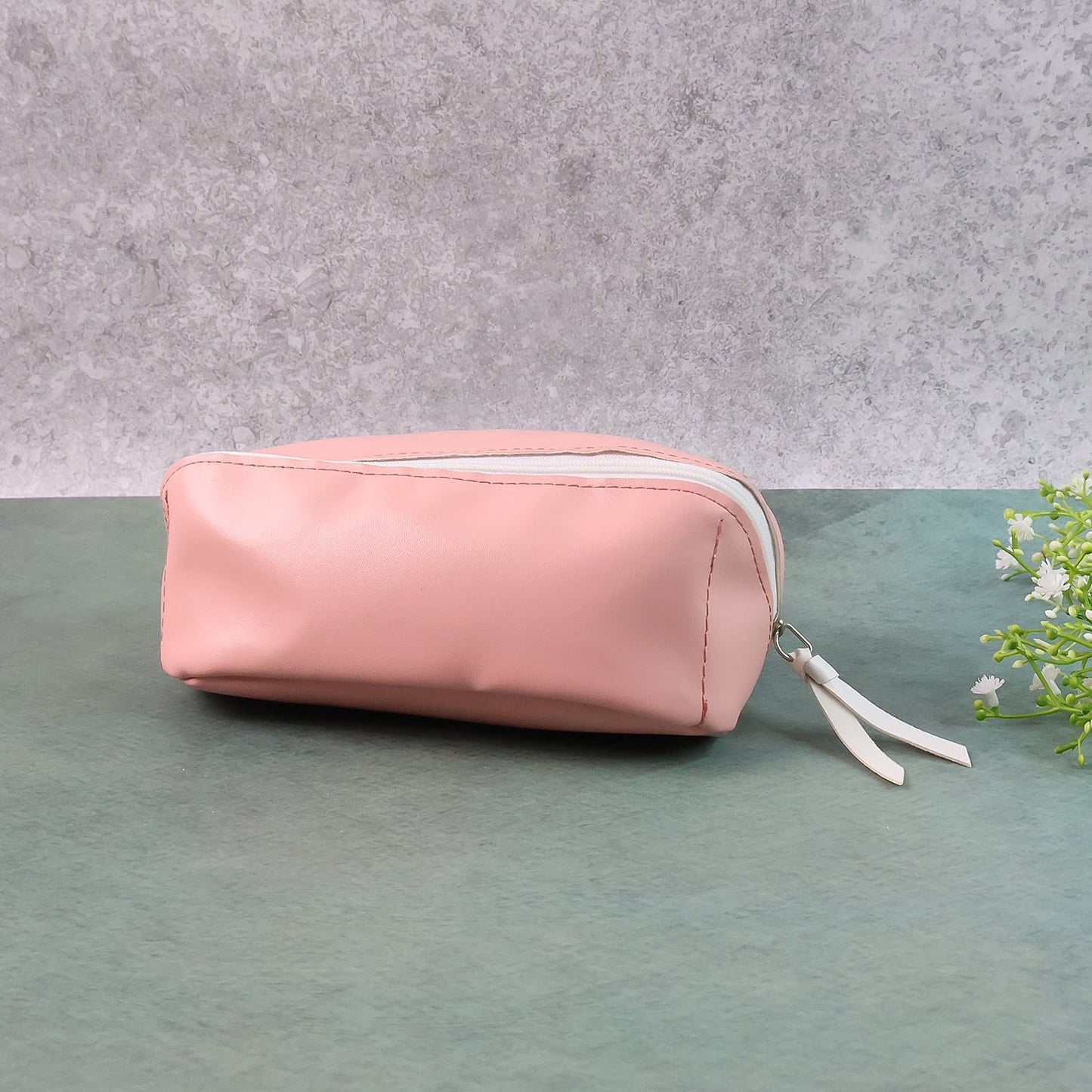 Compact PU leather travel organizer pouch filled with makeup brushes and stationery.