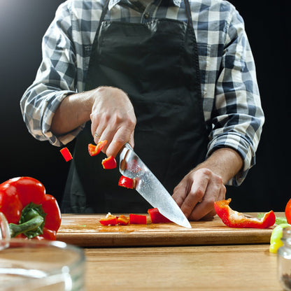 Reversible wooden slicing board with a prominent handle for easy grip.