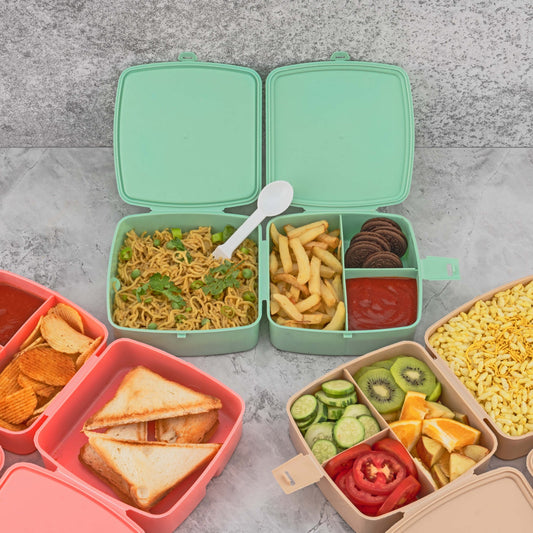 Front view of a blue Double Layer Lunch Box with a spoon and four internal compartments.