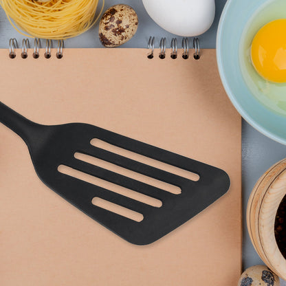 Versatile silicone kitchen turner with an ergonomic handle.