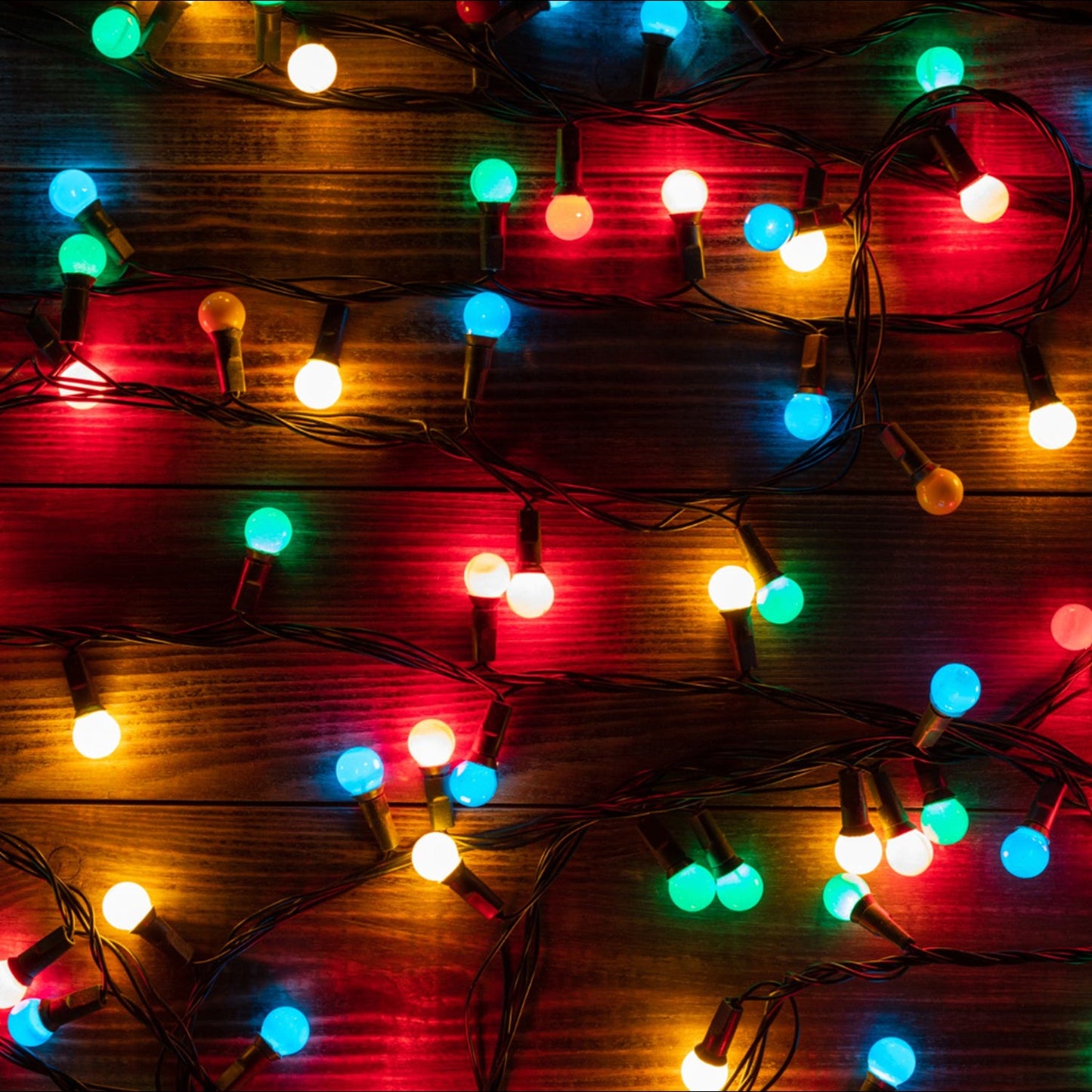 Bright multi-color LED string light illuminating a festive scene, 6 meters long.