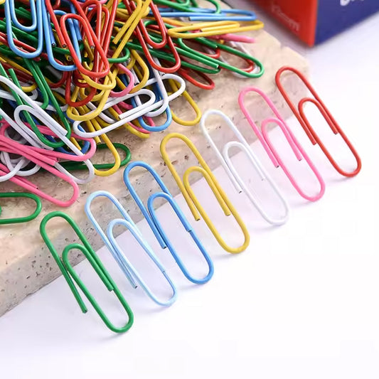 Clear plastic box containing assorted color U-shape paper clips 28mm