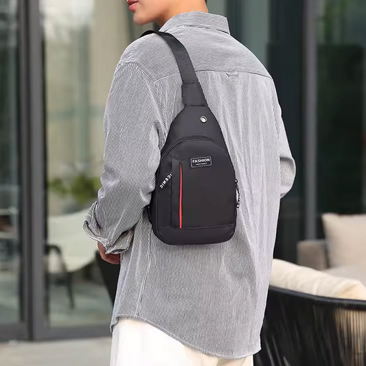 Waterproof crossbody bag in black and grey, worn across the chest.