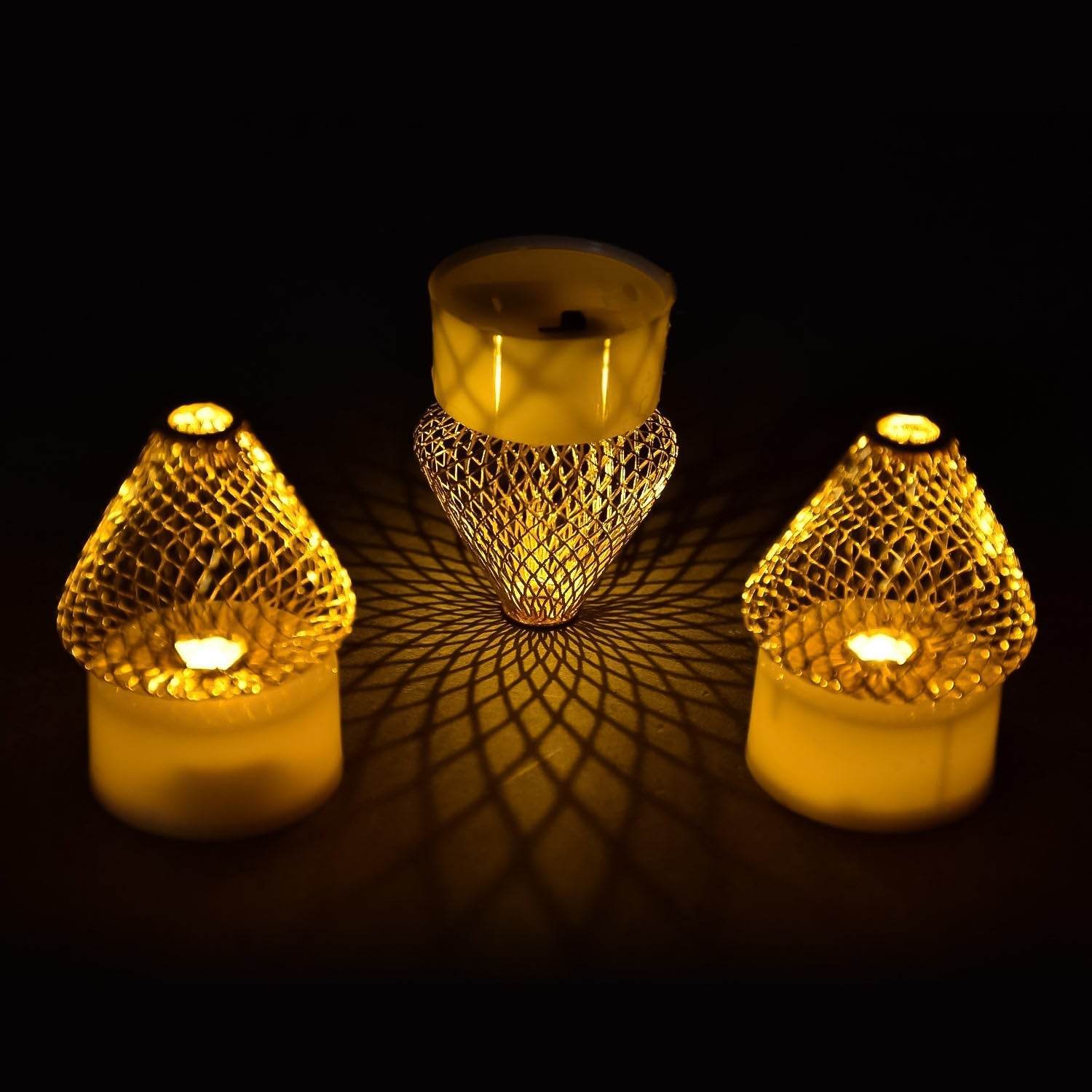 Four LED flameless candle lights with metal mesh shades ideal for home decor