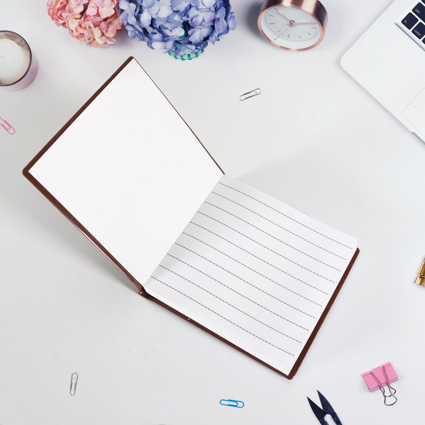 Young child happily writing in a chocolate scented notebook.