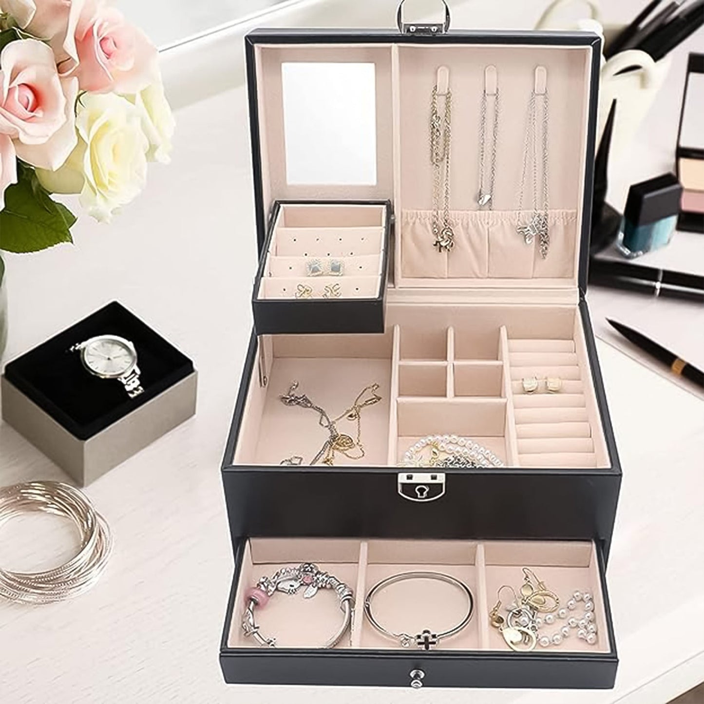 Interior view of the velvet-lined jewellery box, with ring rolls and earring card.