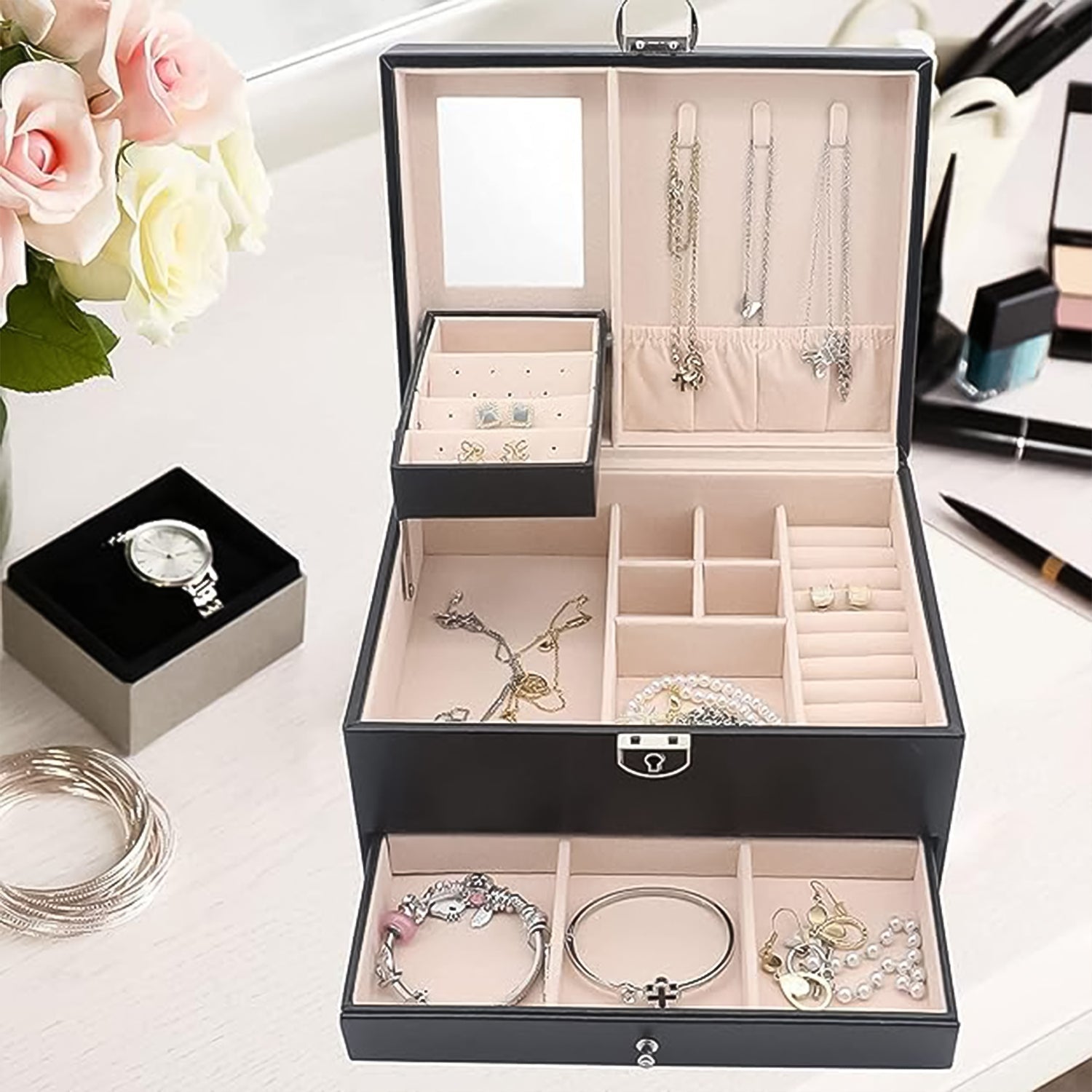 Interior view of the velvet-lined jewellery box, with ring rolls and earring card.