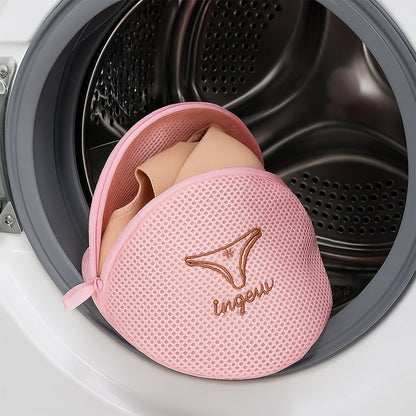 Lingerie wash bag with a bra inside, demonstrating its protective capacity.