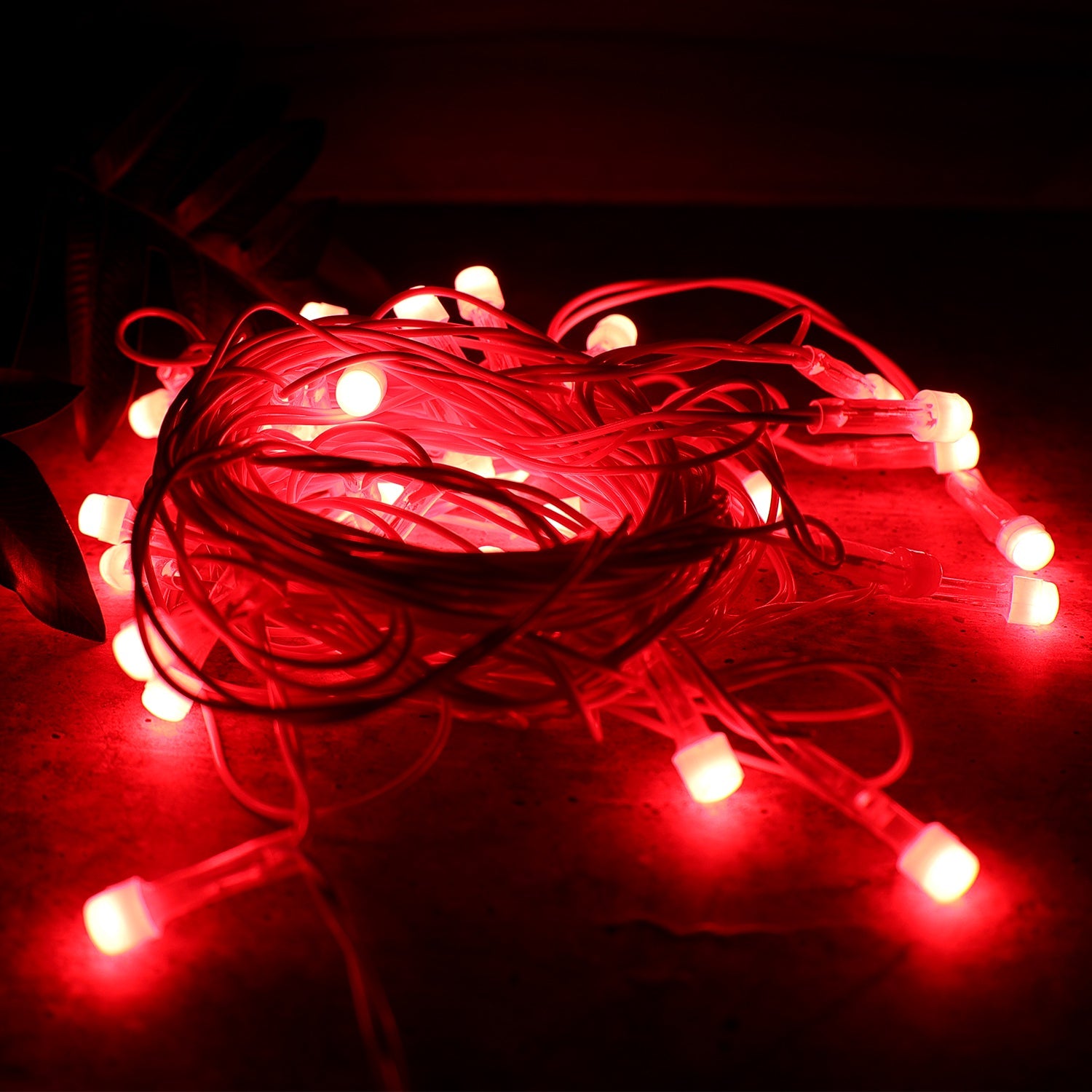 Multi-angle view of LED decorative fairy lights with red glowing bulbs