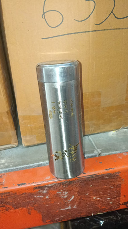 The 380ml stainless steel travel bottle placed on a desk.