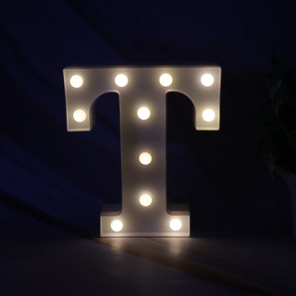 Close up of decorative LED lamp shaped as letter T