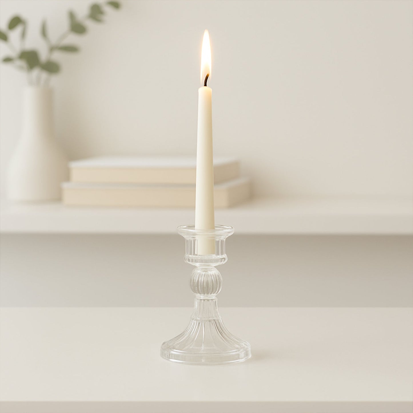 Crystal glass candle stand displaying stable base and clear glass