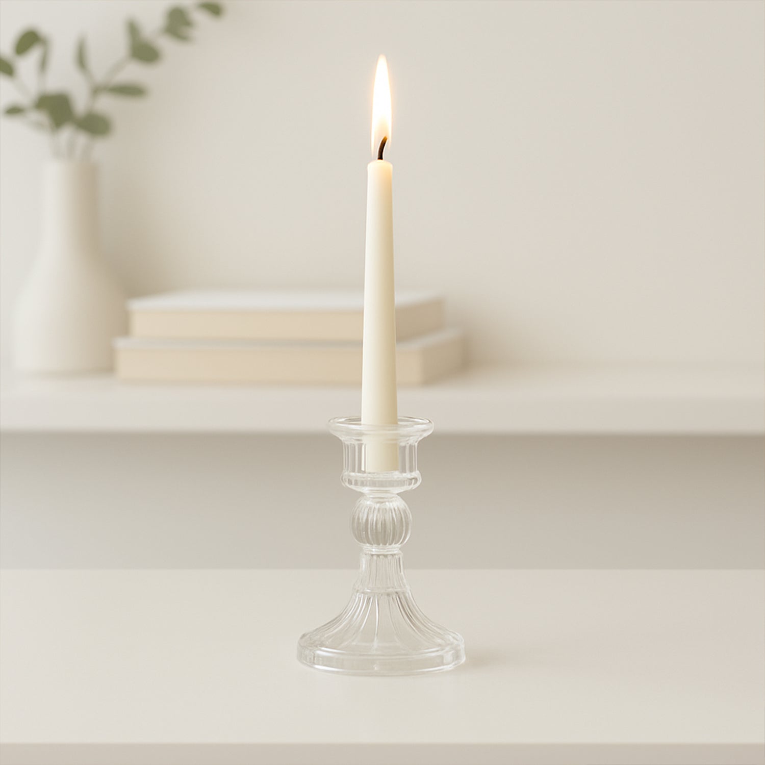 Crystal glass candle stand displaying stable base and clear glass