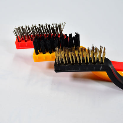 A person using the nylon mini wire brush to clean delicate areas without scratching.