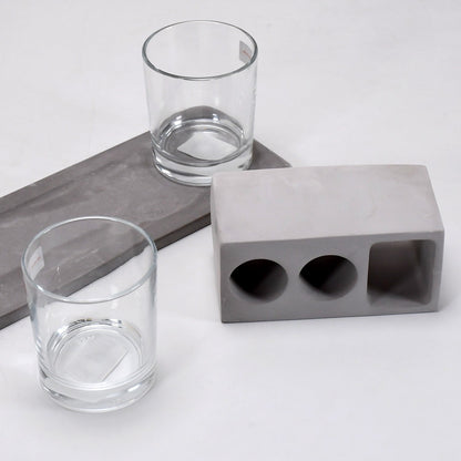 Elegant wine glass holder set with two glasses on a marble base, ideal for home decor.