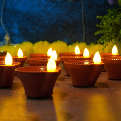Water Sensor Diyas glowing warmly in a festive Diwali setup.