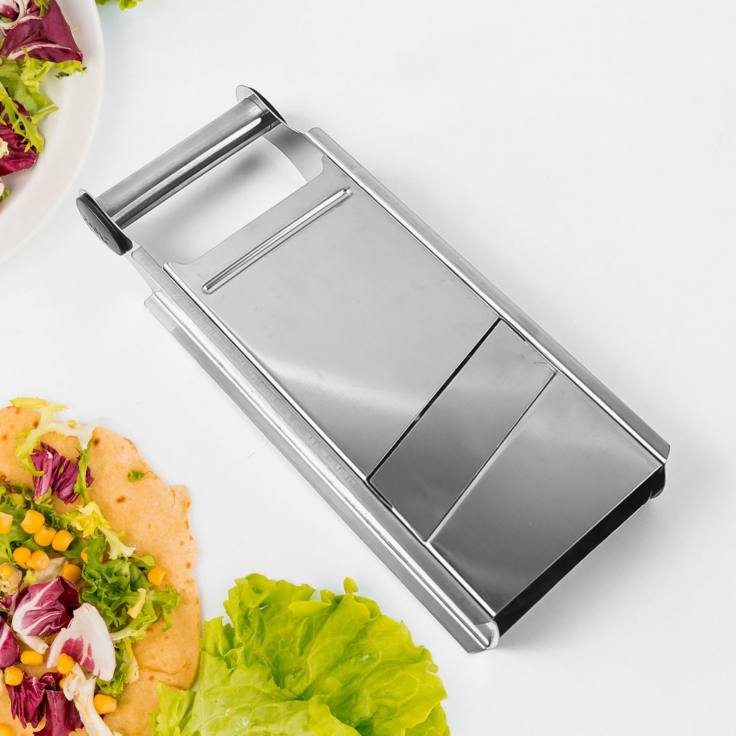 Close-up of Apex kitchen slicer’s sharp stainless steel blades