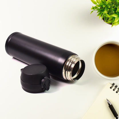A child's hand holding a leak-proof kids insulated water bottle, ready for adventure.