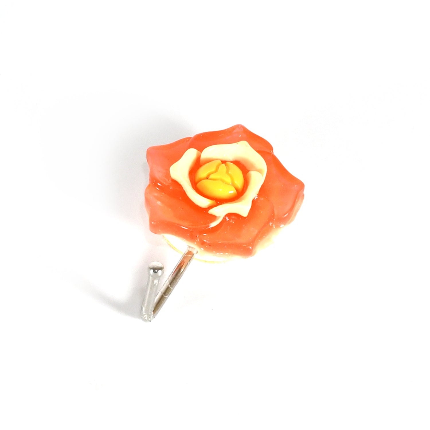 Various items like keys and a small towel hanging from self adhesive wall hooks in a hallway.