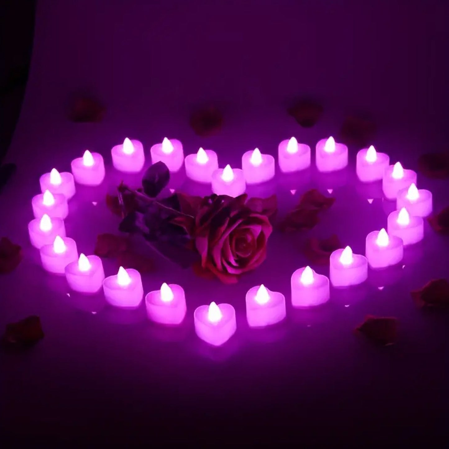 A group of LED tealight candles illuminating a festive setting.