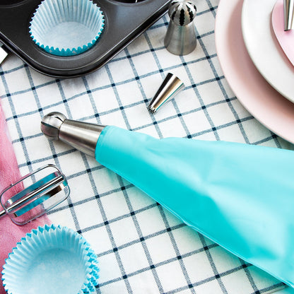 Different types of stainless steel nozzles from the cake decorating set arranged neatly.