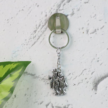Detailed view of durable metal Radha Krishna keychain with ornate craftsmanship