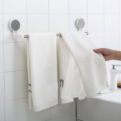 Punch-free towel rod with stable end brackets on smooth bathroom surface